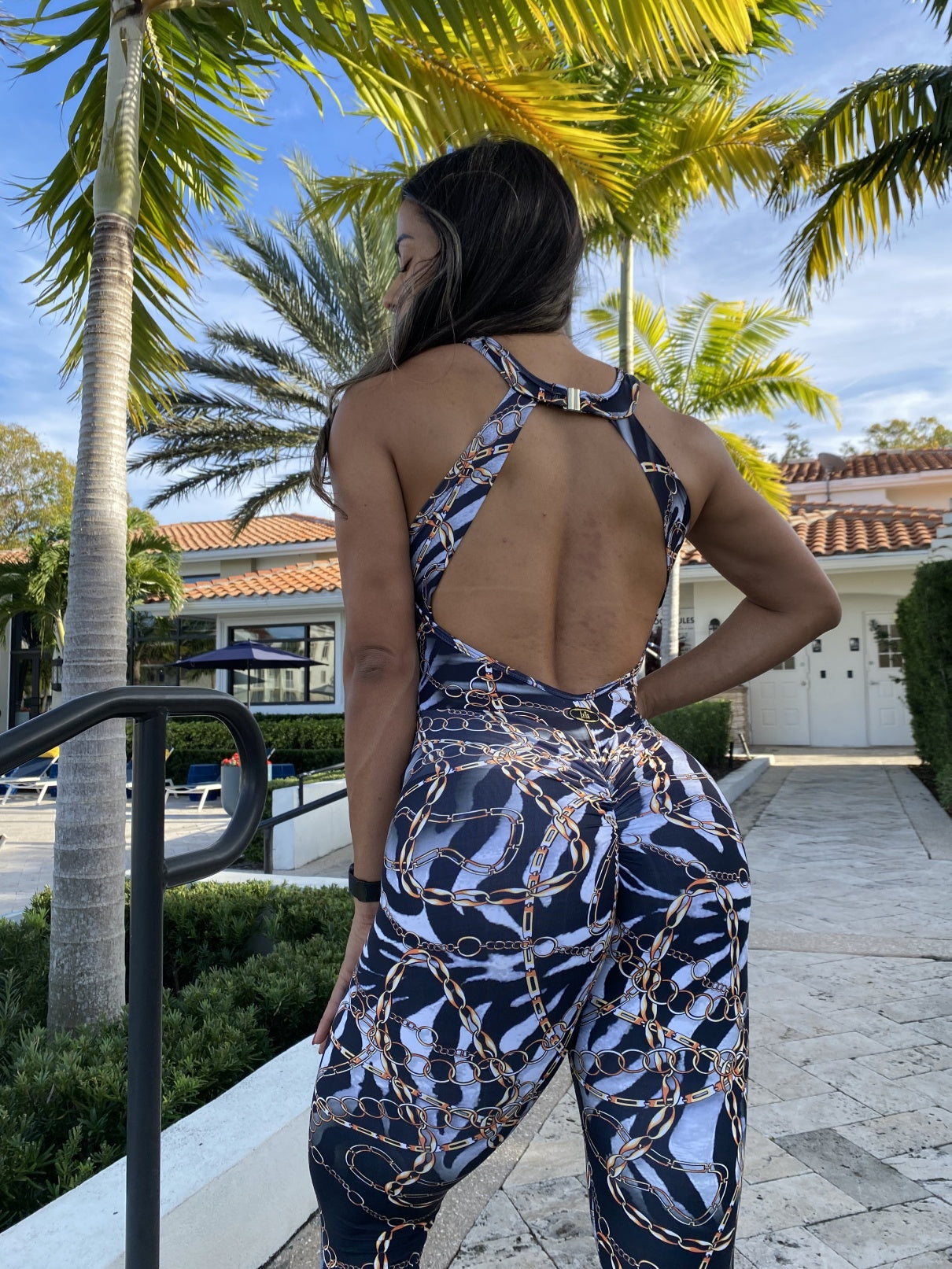 SCRUNCH BOOTY ZEBRA AND GOLD CHAIN JUMPSUIT